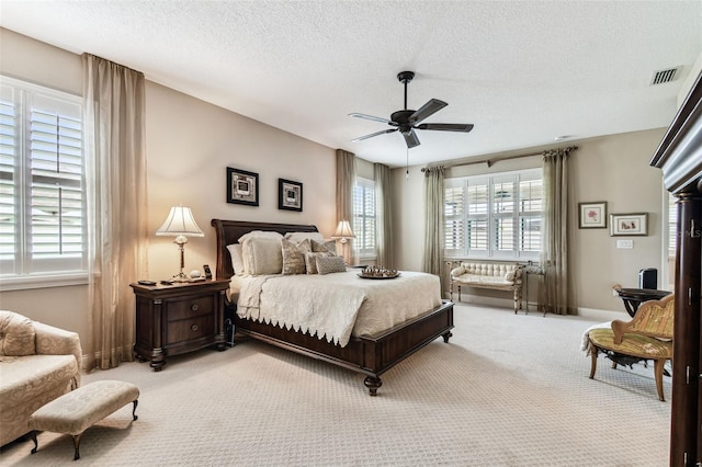3302 Granite Ridge Loop, Land O Lakes, FL 34638 - carpeted bedroom with a textured ceiling, ceiling fan, and baseboards