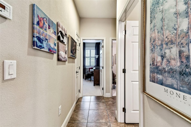 3302 Granite Ridge Loop, Land O Lakes, FL 34638 - hallway featuring tile patterned floors and baseboards