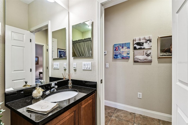 3302 Granite Ridge Loop, Land O Lakes, FL 34638 - bathroom with vanity, tile patterned flooring, and baseboards