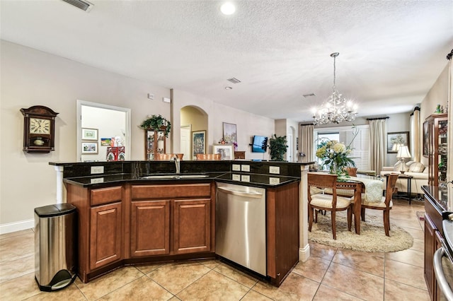 3302 Granite Ridge Loop, Land O Lakes, FL 34638 - kitchen featuring stainless steel dishwasher, a sink, arched walkways, a chandelier, and decorative light fixtures