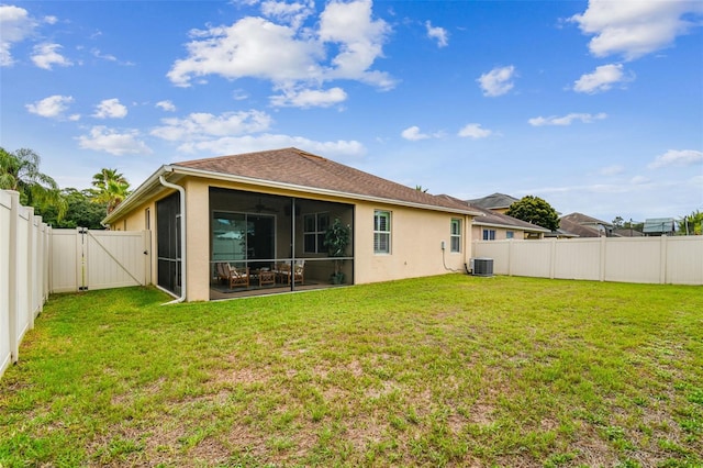 3302 Granite Ridge Loop, Land O Lakes, FL 34638 - rear view of property with a gate, a sunroom, stucco siding, and cooling unit