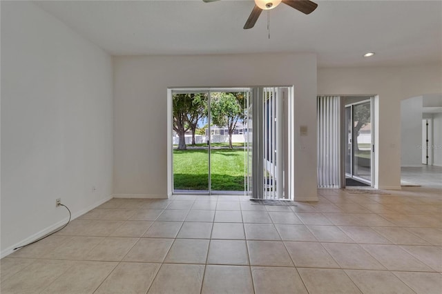 2803 Abbey Grove Dr, Valrico, FL 33594 - tiled empty room with arched walkways, a ceiling fan, baseboards, and recessed lighting