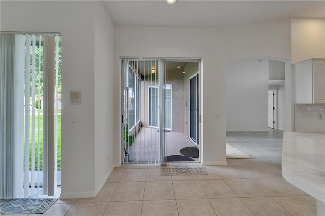 2803 Abbey Grove Dr, Valrico, FL 33594 - entrance foyer with plenty of natural light, arched walkways, light tile patterned flooring, and recessed lighting