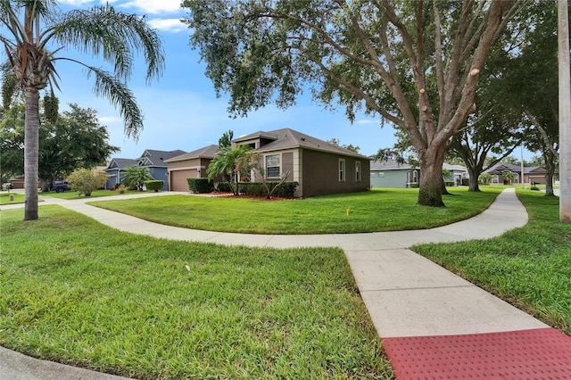 2803 Abbey Grove Dr, Valrico, FL 33594 - view of front facade featuring a front yard, a garage, a residential view, and driveway
