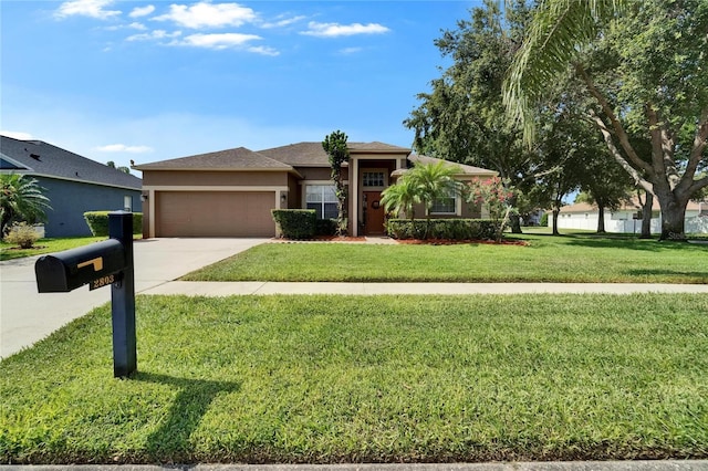 2803 Abbey Grove Dr, Valrico, FL 33594 - view of front of home with an attached garage, stucco siding, concrete driveway, and a front lawn