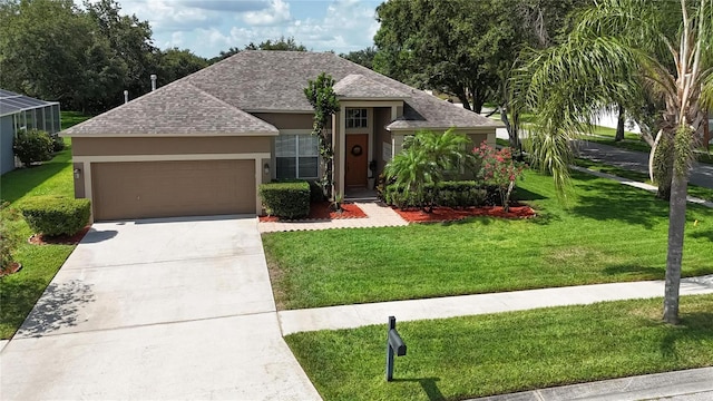 2803 Abbey Grove Dr, Valrico, FL 33594 - view of front of property featuring roof with shingles, stucco siding, a garage, and a front yard