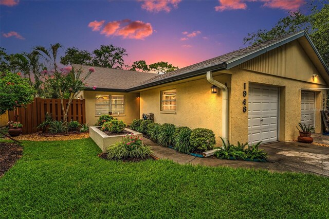 1948 Elaine Dr, Clearwater, FL 33760 - ranch-style home with stucco siding, concrete driveway, and an attached garage