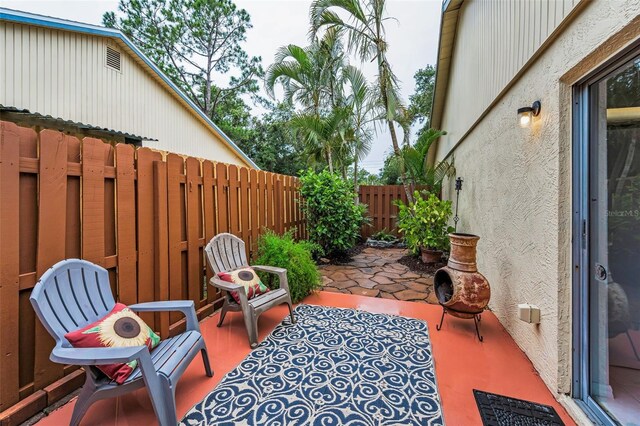 1948 Elaine Dr, Clearwater, FL 33760 - fenced backyard featuring a patio