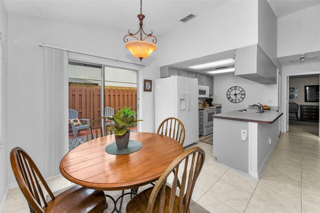 1948 Elaine Dr, Clearwater, FL 33760 - dining space featuring light tile patterned floors and baseboards
