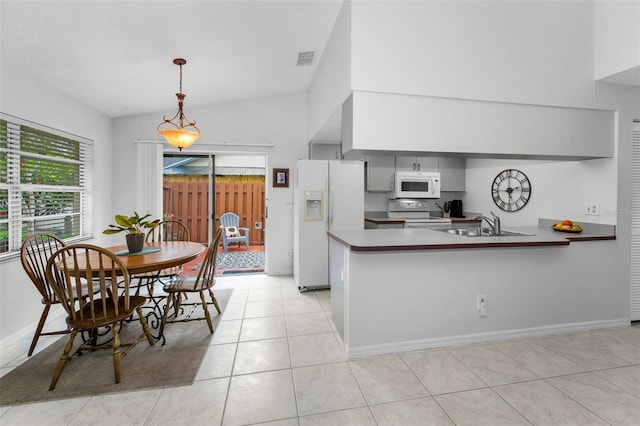 1948 Elaine Dr, Clearwater, FL 33760 - kitchen with white appliances, a sink, a peninsula, light tile patterned flooring, and pendant lighting