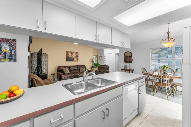 1948 Elaine Dr, Clearwater, FL 33760 - kitchen with dishwasher, a sink, light countertops, and white cabinetry