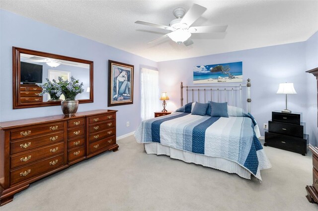 1948 Elaine Dr, Clearwater, FL 33760 - bedroom featuring light colored carpet, baseboards, and a ceiling fan