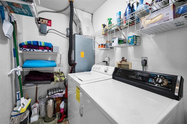 1948 Elaine Dr, Clearwater, FL 33760 - washroom with washing machine and dryer and a textured ceiling