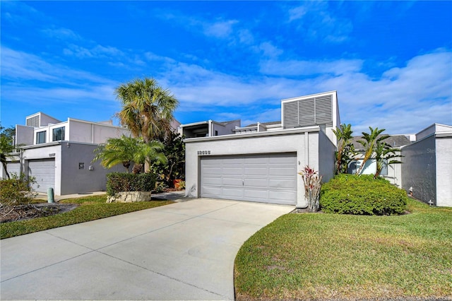 13635 Twin Lakes Ln Unit 13635, Tampa, FL 33618 - contemporary home with driveway, stucco siding, and a front lawn