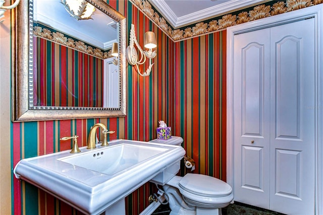 13635 Twin Lakes Ln Unit 13635, Tampa, FL 33618 - bathroom featuring wallpapered walls, ornamental molding, toilet, and a sink
