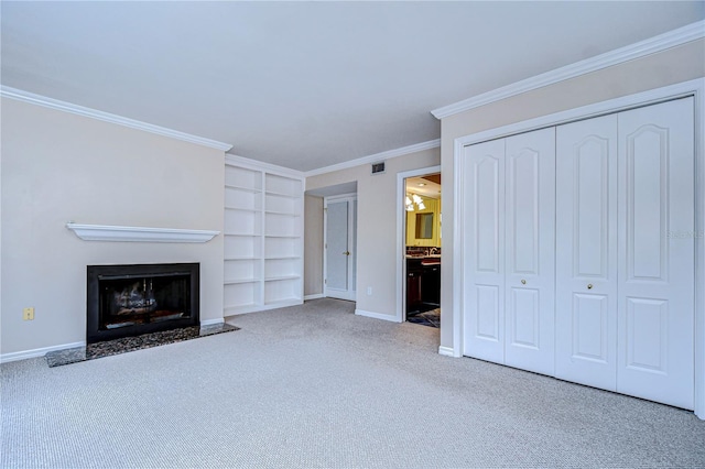 13635 Twin Lakes Ln Unit 13635, Tampa, FL 33618 - unfurnished living room featuring built in features, carpet flooring, baseboards, a fireplace with flush hearth, and ornamental molding
