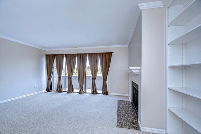 13635 Twin Lakes Ln Unit 13635, Tampa, FL 33618 - unfurnished living room with crown molding, baseboards, carpet flooring, and a fireplace with flush hearth