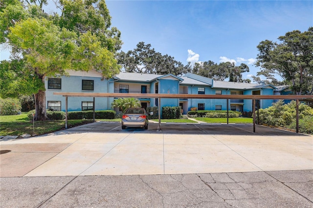 11800 Park Blvd Unit 208, Seminole, FL 33772 - townhome / multi-family property featuring covered parking and stucco siding