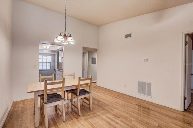 11800 Park Blvd Unit 208, Seminole, FL 33772 - dining area with a chandelier and light wood-style floors