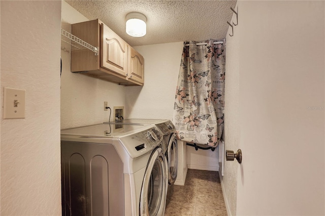 11800 Park Blvd Unit 208, Seminole, FL 33772 - washroom with independent washer and dryer, cabinet space, a textured ceiling, and a textured wall