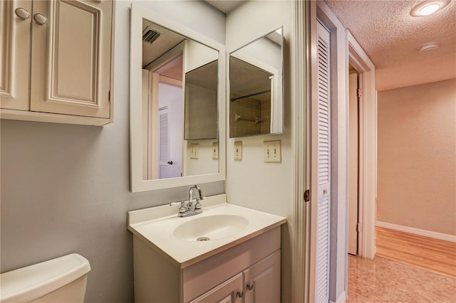 11800 Park Blvd Unit 208, Seminole, FL 33772 - bathroom featuring vanity and a textured ceiling
