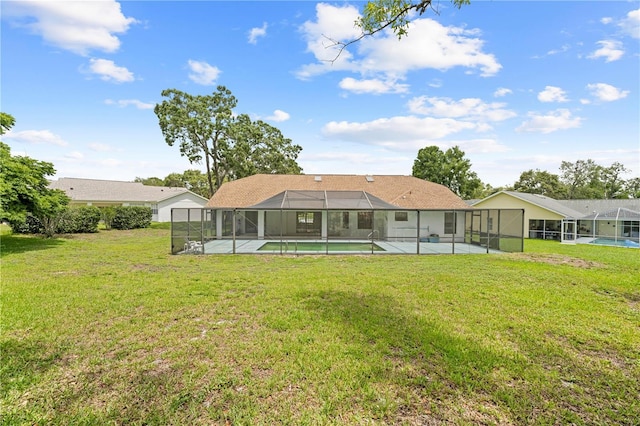 206 Forest Wood Ct, Spring Hill, FL 34609 - back of property featuring an outdoor pool, a lawn, glass enclosure, and a patio