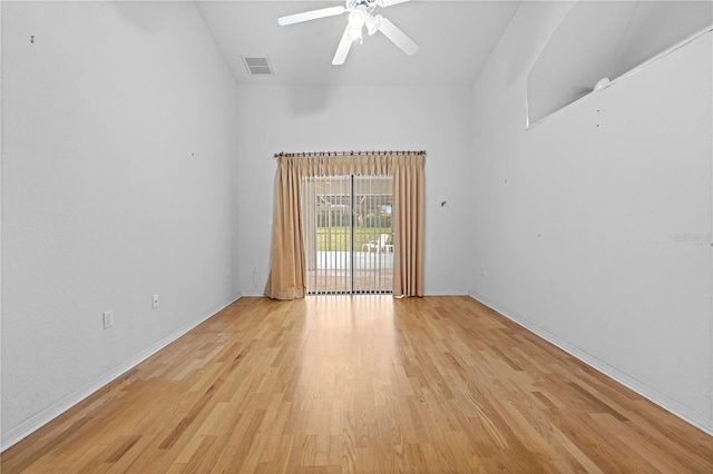 206 Forest Wood Ct, Spring Hill, FL 34609 - empty room with light wood-style flooring, baseboards, a ceiling fan, and lofted ceiling