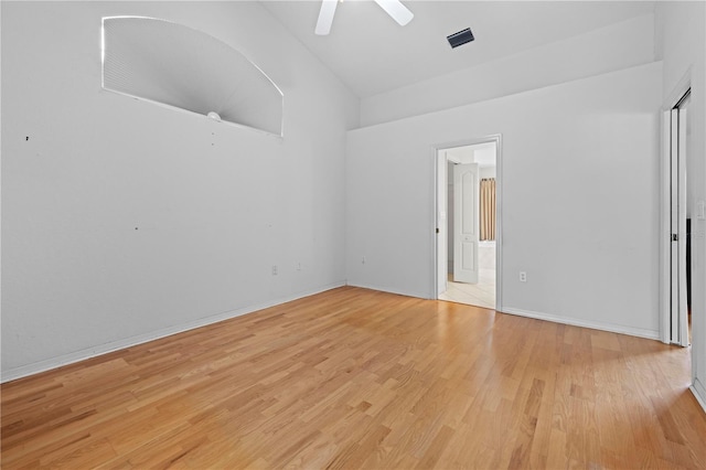 206 Forest Wood Ct, Spring Hill, FL 34609 - empty room featuring light wood finished floors, a ceiling fan, high vaulted ceiling, and baseboards