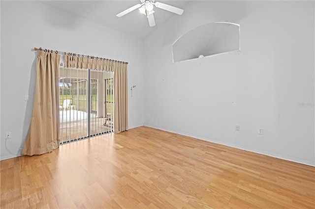 206 Forest Wood Ct, Spring Hill, FL 34609 - unfurnished room featuring light wood-type flooring, a ceiling fan, high vaulted ceiling, and baseboards