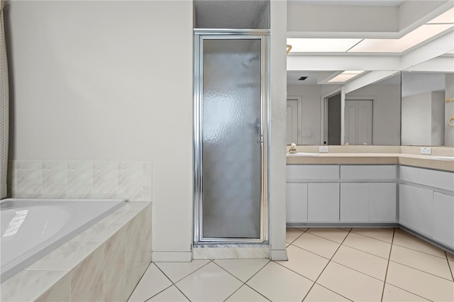 206 Forest Wood Ct, Spring Hill, FL 34609 - full bathroom with a shower stall, vanity, tile patterned flooring, and a garden tub