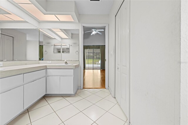 206 Forest Wood Ct, Spring Hill, FL 34609 - bathroom with double vanity, a ceiling fan, and tile patterned floors