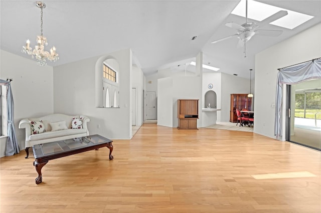 206 Forest Wood Ct, Spring Hill, FL 34609 - sitting room with a chandelier, light wood-type flooring, a ceiling fan, and high vaulted ceiling