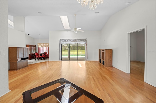 206 Forest Wood Ct, Spring Hill, FL 34609 - living room featuring a chandelier, high vaulted ceiling, wood finished floors, and ceiling fan