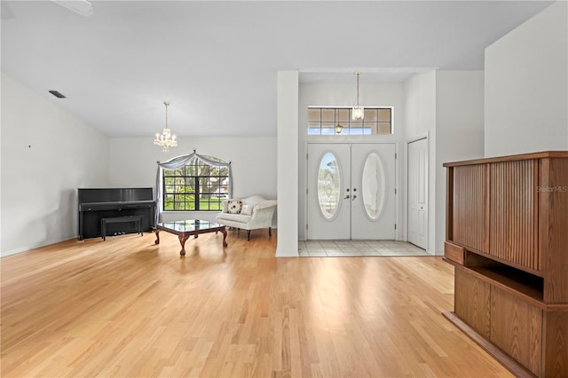 206 Forest Wood Ct, Spring Hill, FL 34609 - foyer entrance featuring a chandelier and light wood-style floors