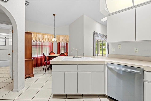 206 Forest Wood Ct, Spring Hill, FL 34609 - kitchen with dishwasher, a sink, light countertops, a peninsula, and white cabinets