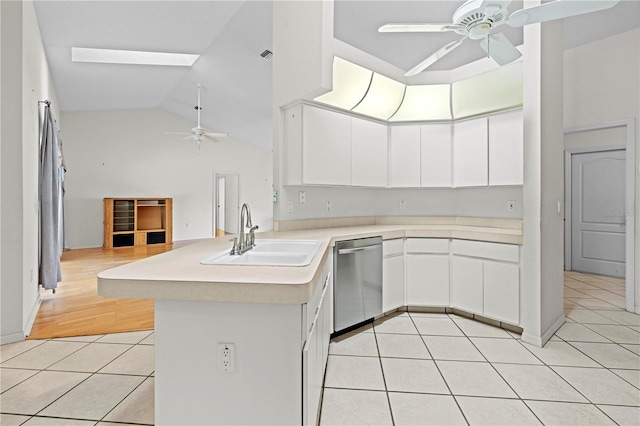 206 Forest Wood Ct, Spring Hill, FL 34609 - kitchen featuring ceiling fan, a sink, dishwasher, light tile patterned floors, and high vaulted ceiling