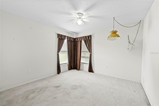 206 Forest Wood Ct, Spring Hill, FL 34609 - carpeted empty room featuring a ceiling fan, a textured ceiling, and baseboards