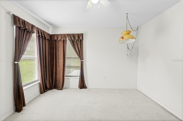 206 Forest Wood Ct, Spring Hill, FL 34609 - unfurnished room featuring carpet floors, a textured ceiling, a ceiling fan, and baseboards