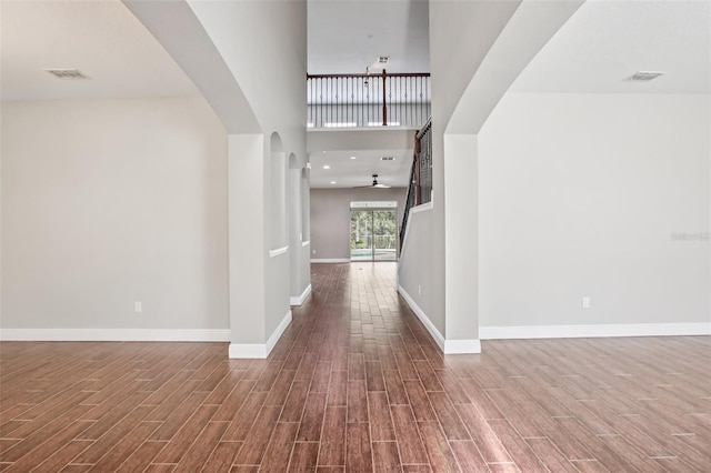 19711 Wellington Manor Blvd, Lutz, FL 33549 - entrance foyer with wood finished floors, arched walkways, and stairs