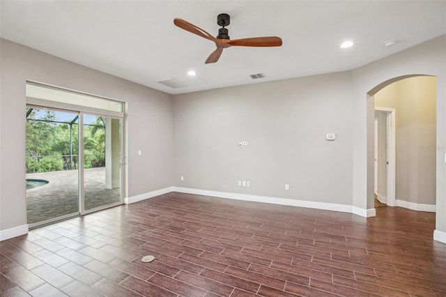 19711 Wellington Manor Blvd, Lutz, FL 33549 - unfurnished room with arched walkways, ceiling fan, wood finished floors, recessed lighting, and a smoke detector