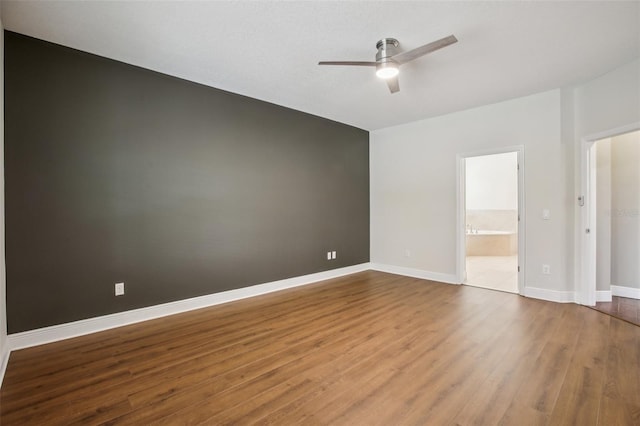 19711 Wellington Manor Blvd, Lutz, FL 33549 - spare room with a ceiling fan and wood finished floors