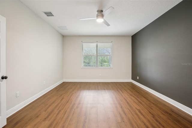 19711 Wellington Manor Blvd, Lutz, FL 33549 - spare room featuring ceiling fan and wood finished floors