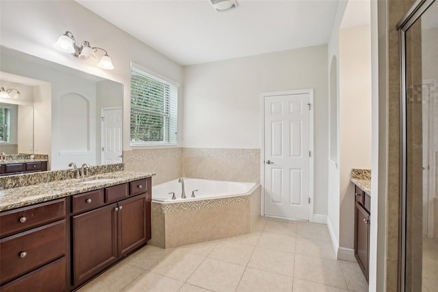 19711 Wellington Manor Blvd, Lutz, FL 33549 - bathroom featuring vanity, a bath, a shower stall, and tile patterned floors