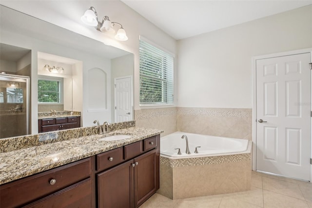 19711 Wellington Manor Blvd, Lutz, FL 33549 - full bath with a stall shower, vanity, a garden tub, and tile patterned flooring