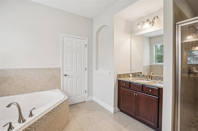 19711 Wellington Manor Blvd, Lutz, FL 33549 - bathroom featuring a bath, vanity, a shower stall, and tile patterned floors