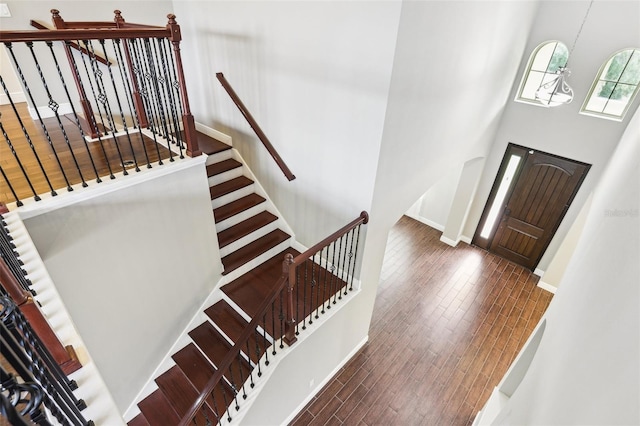 19711 Wellington Manor Blvd, Lutz, FL 33549 - entryway featuring wood finished floors, a high ceiling, and stairway