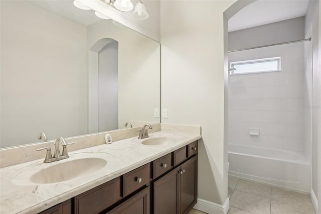 19711 Wellington Manor Blvd, Lutz, FL 33549 - full bath featuring double vanity, tile patterned floors, and washtub / shower combination