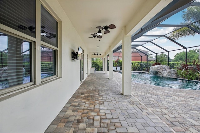 19711 Wellington Manor Blvd, Lutz, FL 33549 - outdoor pool featuring a ceiling fan, a patio area, and glass enclosure