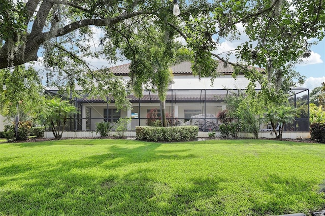 19711 Wellington Manor Blvd, Lutz, FL 33549 - rear view of property with a tiled roof, a yard, stucco siding, and a lanai