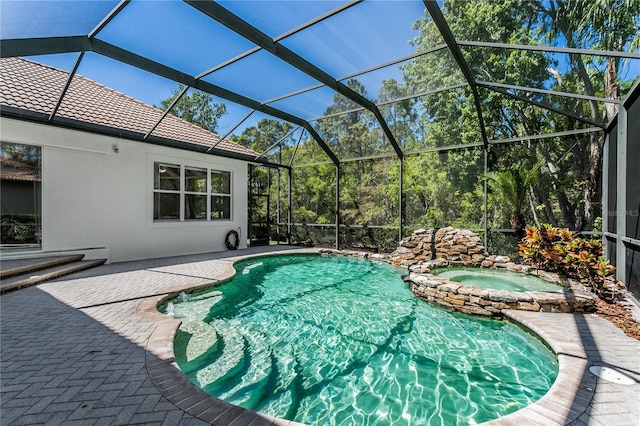 11938 Royce Waterford Cir, Tampa, FL 33626 - view of swimming pool with a patio area, a pool with connected hot tub, and glass enclosure